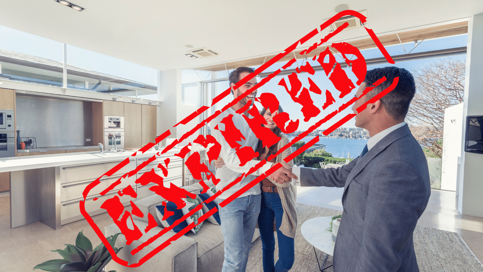 Realtor With Expired License In Kitchen With Couple 